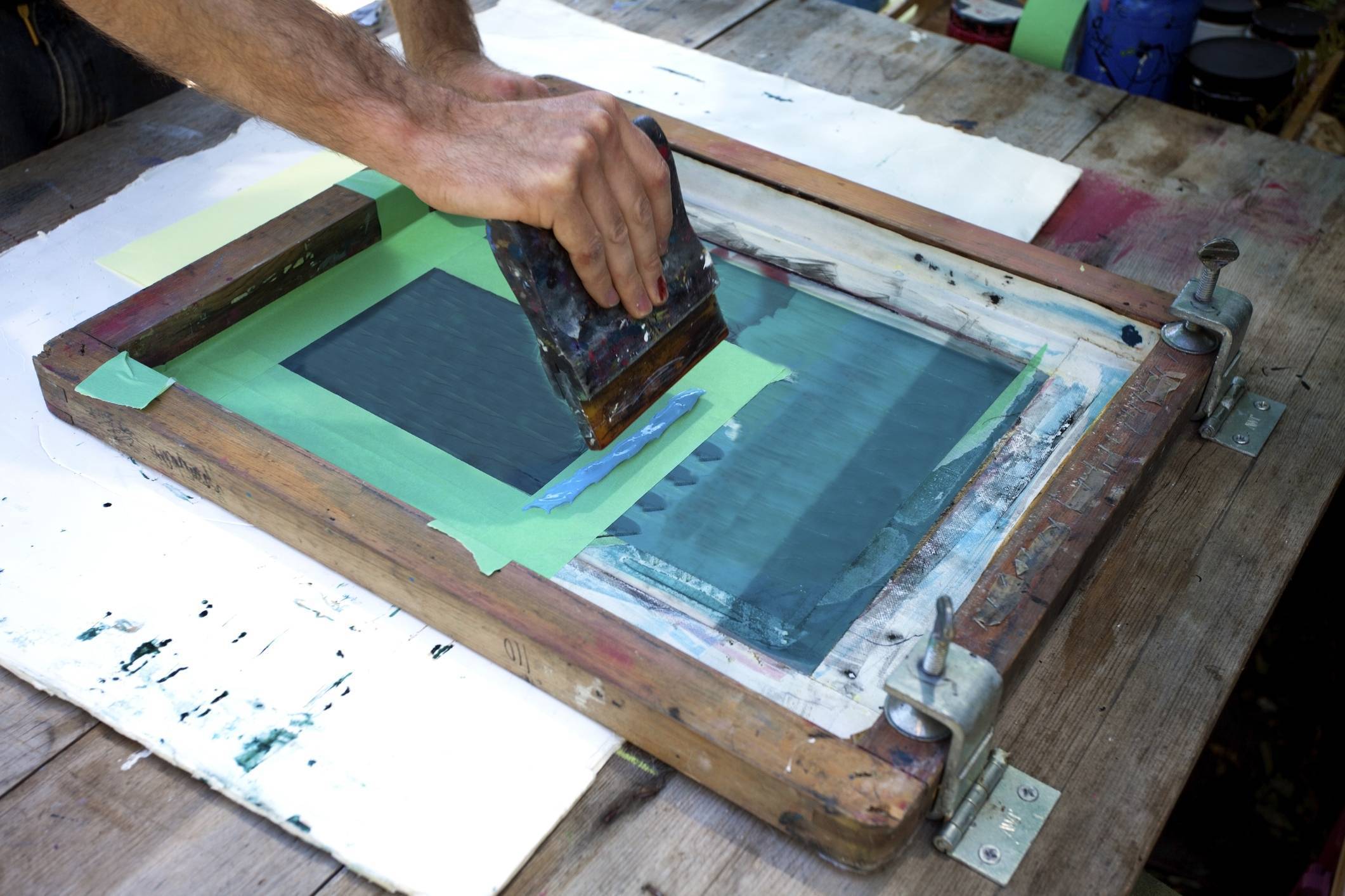 photo of artist working on screen printing