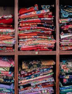 Shelves of clothing printed with water-based pigment inkjet ink