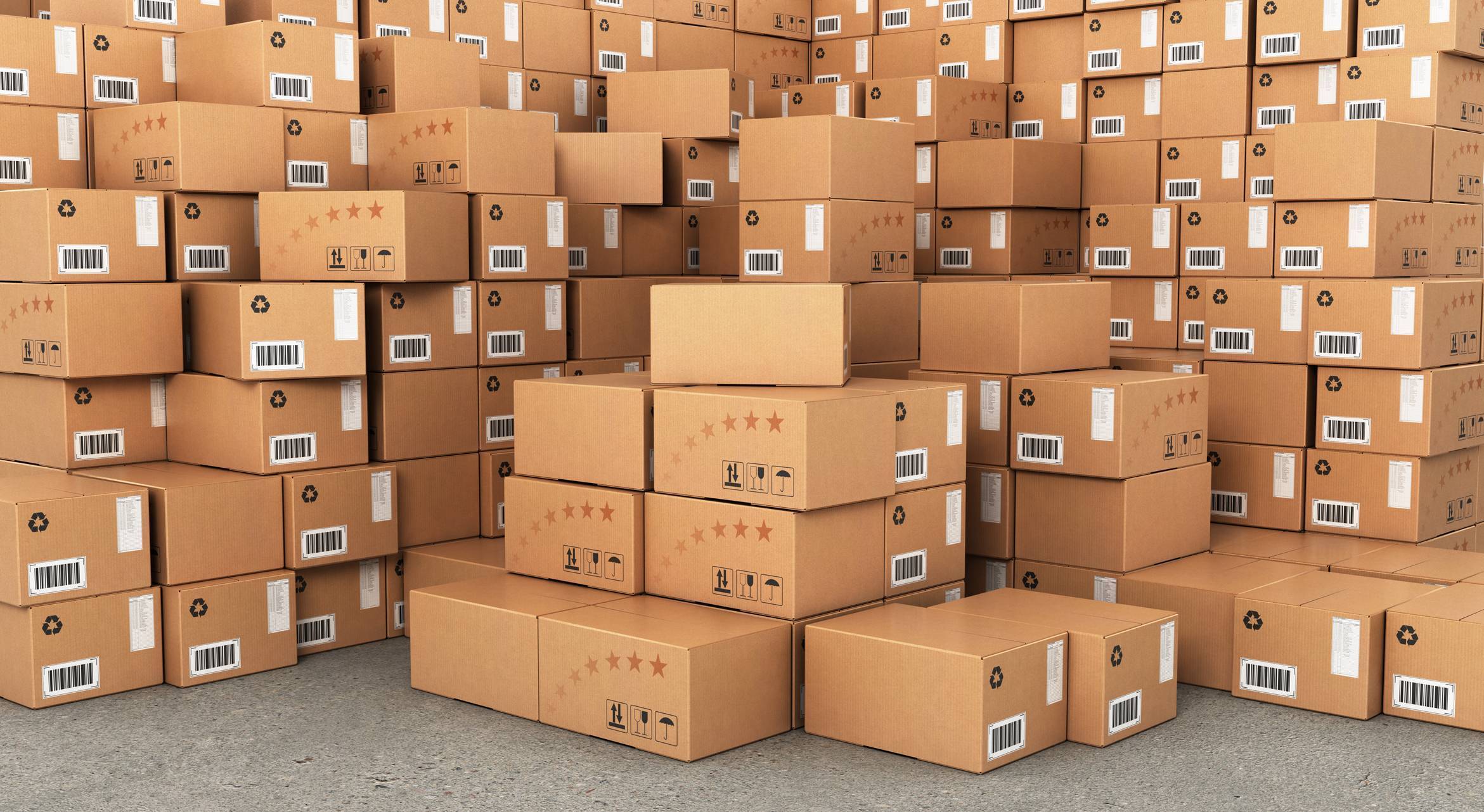 Large stacks of cardboard boxes featuring ink and labels.