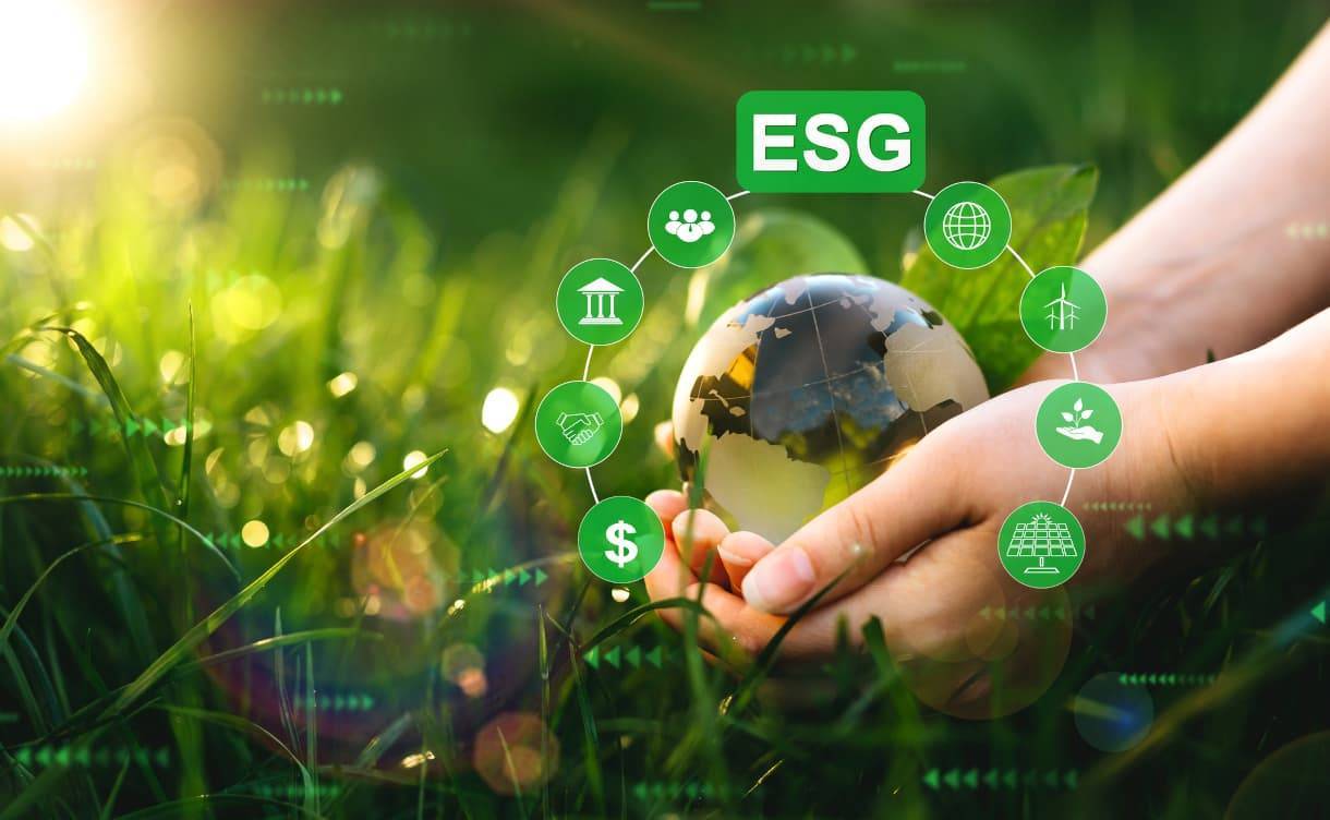 Hands holding crystal globe with ESG icons